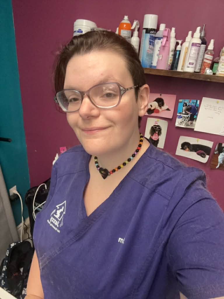 Sam in her work atire posing for a photo.